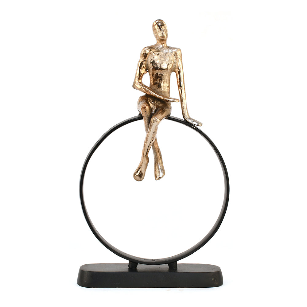 Man Sitting On Cirque Decorative Metal Showpiece- Black & Gold