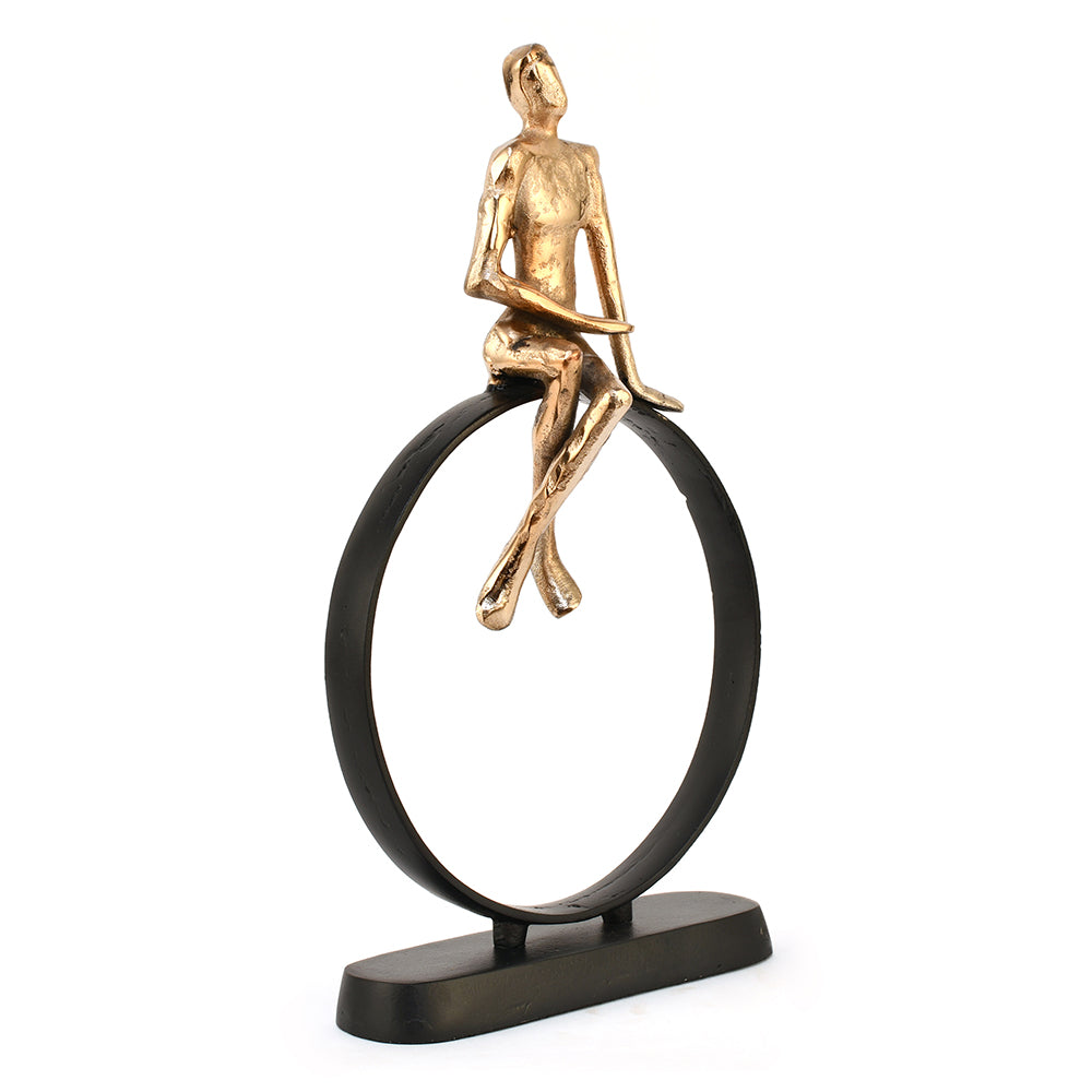 Man Sitting On Cirque Decorative Metal Showpiece- Black & Gold