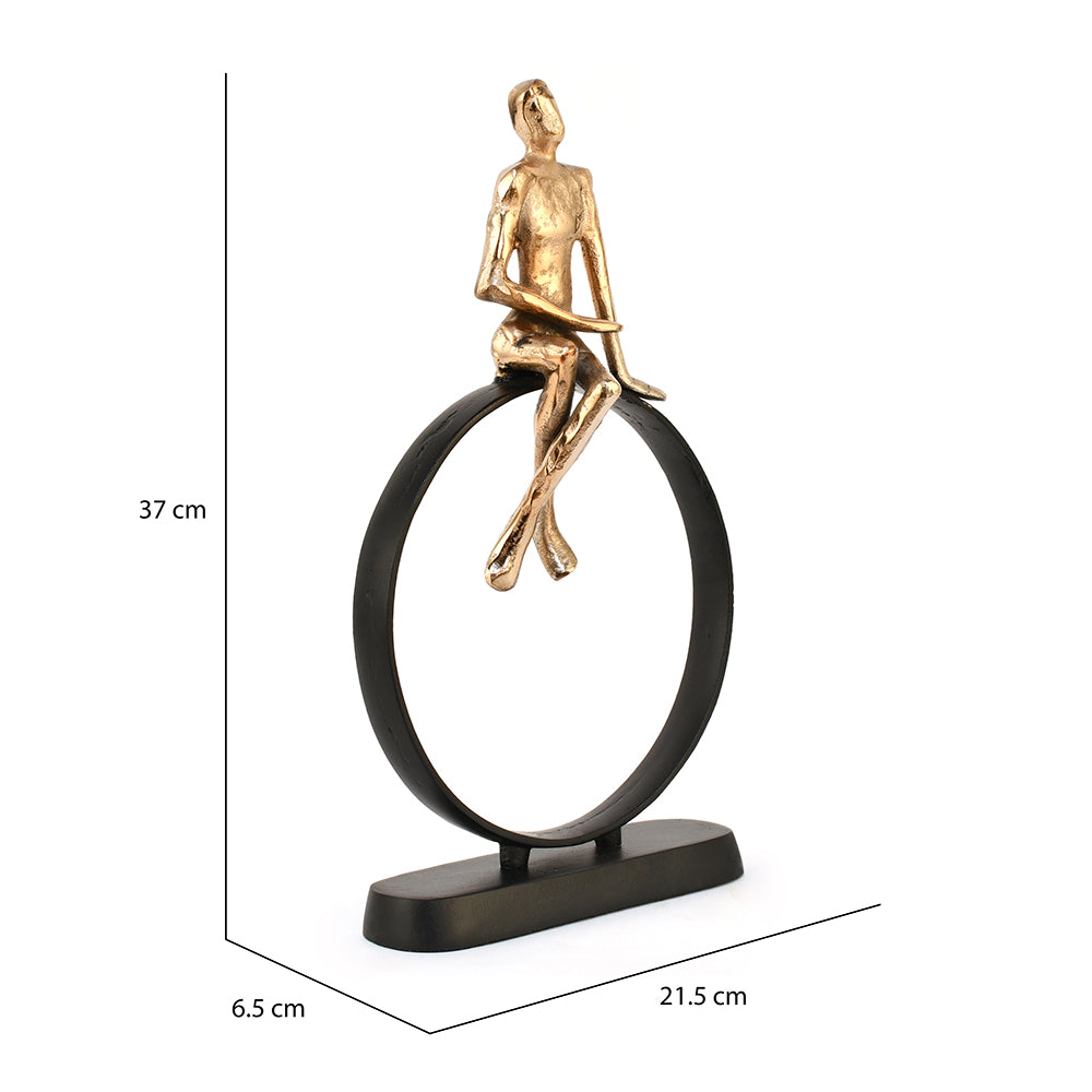 Man Sitting On Cirque Decorative Metal Showpiece- Black & Gold