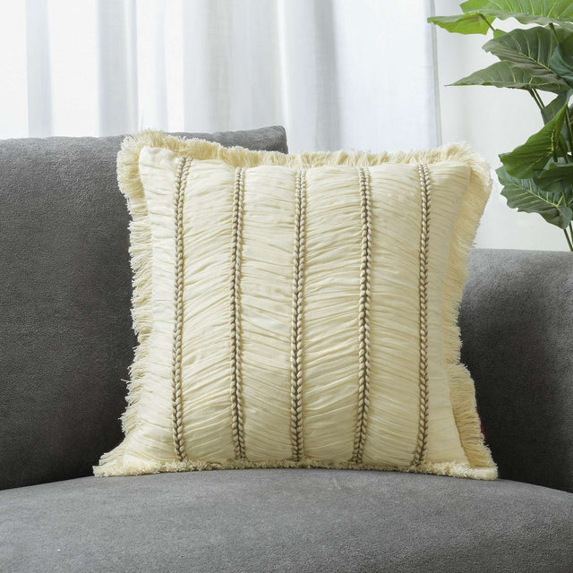 Textured cream cushion on grey sofa with pleated lines 2