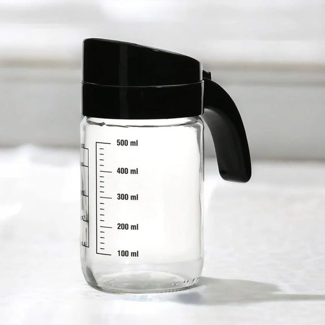 Nilkamal Transparent 660 Ml Glass Oil Measure Jar With Lid Transparent Black