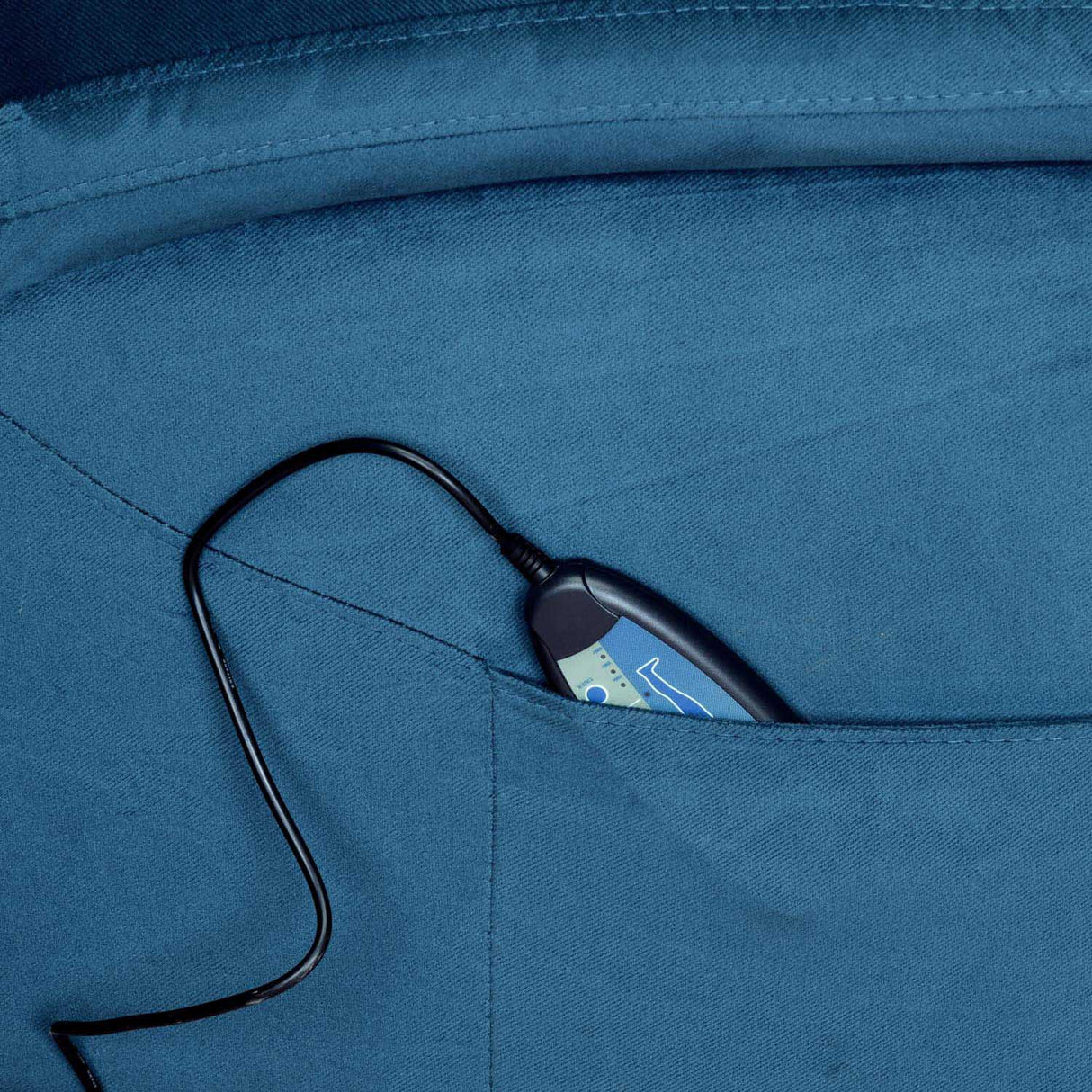 Remote control in side pocket of blue recliner chair 2