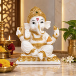 Vandanam Decorative Sitting Ganesha with Modak Showpiece- White & Gold
