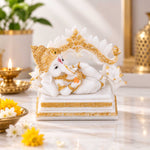 Vandanam Decorative Resting Ganesha with Modak Showpiece- White & Gold