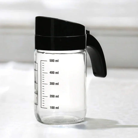 Nilkamal Transparent 660 Ml Glass Oil Measure Jar With Lid Transparent Black