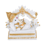 Vandanam Decorative Resting Ganesha with Modak Showpiece- White & Gold