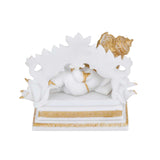 Vandanam Decorative Resting Ganesha with Modak Showpiece- White & Gold