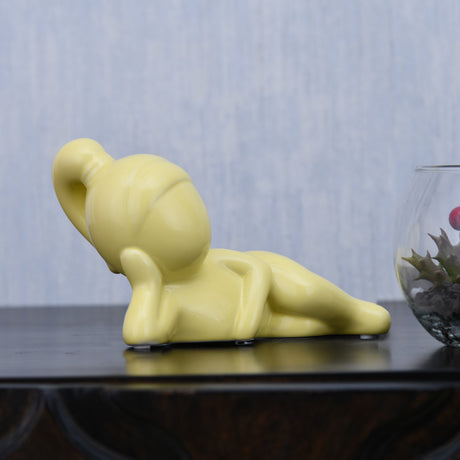 Nilkamal Girl Resting Polyresin Decorative Showpiece (Yellow)
