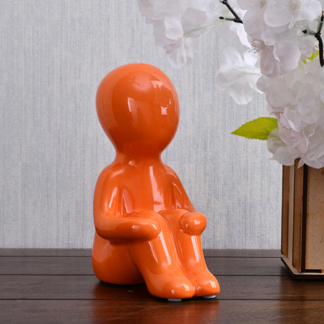 Nilkamal Boy Sitting with Folded Legs Polyresin Decorative Showpiece (Orange)
